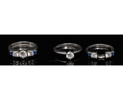 An Unusual pair of interlocking ring, central round brilliant diamond solitaire, approx 0.50ct, 14ct white gold shank; wrappe