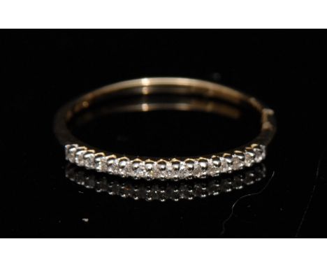 A new diamond half eternity ring, linear set with sixteen diamond accents, 9ct gold shank, size M, 0.8g gross
