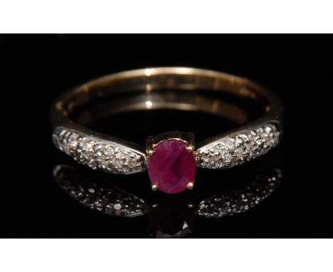 A new ruby and diamond ring, central oval ruby, flanked by pave diamond encrusted shoulders, 9ct gold shank, size P, 1.7g gro