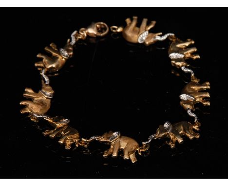 A 9ct gold yellow and white gold bracelet, as a train of eight Elephants, each with white gold ear and raised trunk, unmarked