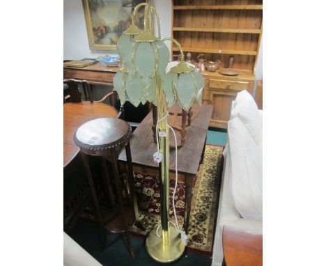A BRASS FIVE BRANCH FLOOR STANDARD LAMP raised on a circular spreading foot 168cm high