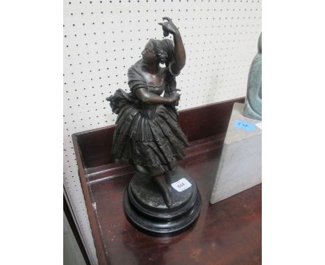 A PAIR OF BRONZED FIGURES modelled as a female and her companion shown standing on a circular base 38cm high