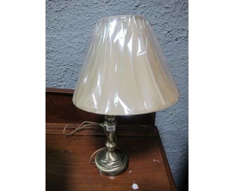 AN ART DECO STYLE TABLE LAMP with beige shade