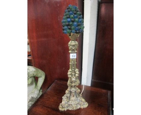 A MOULDED BRASS TABLE LAMP with berry shade 59cm high