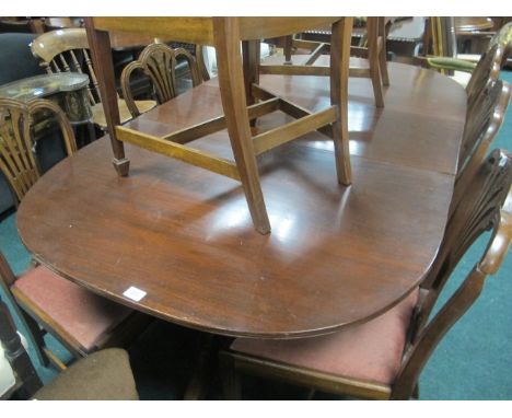 A GEORGIAN STYLE MAHOGANY D-END DINING TABLE the rectangular top with rounded ends and one loose leaf raised on twin tripod s