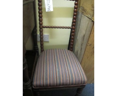 A VICTORIAN MAHOGANY BOBBIN FRAMED CHAIR with upholstered seat on turned legs