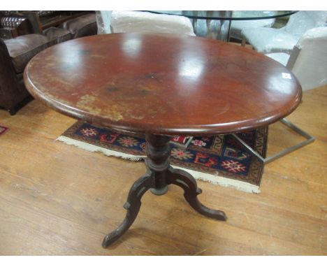 A LATE VICTORIAN OVAL MAHOGANY OCCASIONAL TABLE on tripod base