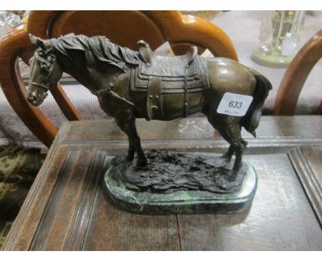 A BRONZE GROUP of a saddled standing horse on green marble base 25cm high