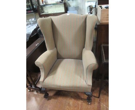 A GOOD CHIPPENDALE STYLE MAHOGANY WING CHAIR with scroll arms and cabriole legs