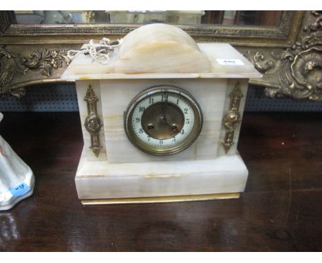 AN ONYX AND BRASS MOUNTED CLOCK of architectural form the brass dial with applied gilt brass mounts on stepped platform base 