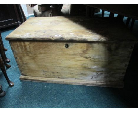 A PINE TRUNK the rectangular hinged top above a plain frieze 43cm (h) x 90cm (w) x 50cm (d)