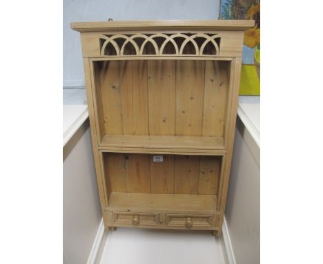 A PINE WALL MOUNTED SHELF with pierced frieze and two short drawers 90cm (h) x 33cm (w)