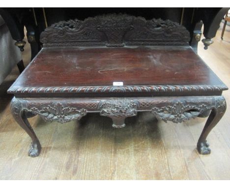 A CHIPPENDALE STYLE MAHOGANY LOW TABLE the gadrooned top above a carved apron on cabriole legs with claw and ball feet 58cm (