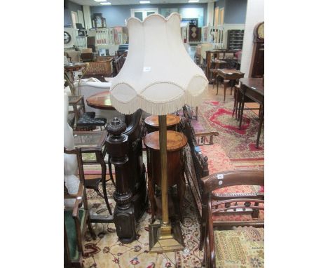 A BRASS CORINTHIAN COLUMN STANDARD LAMP with beige shade