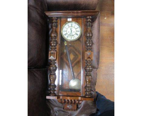 A GOOD VICTORIAN WALNUT CASE VIENNA REGULATOR CLOCK with painted circular enamel dial and turned pilasters 