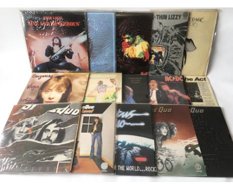 A collection of rock LPs by various artists including Jimi Hendrix, AC/DC, Thin Lizzy, Status Quo and others plus a small sel