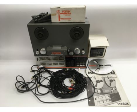 A boxed Fostex A8 eight track recorder/reproducer with an owner's manual, footswitch, remote control unit and leads.