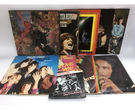 Nine LPs and a 7 inch single by various artists including The Rolling Stones, Santana, Bob Marley and others.