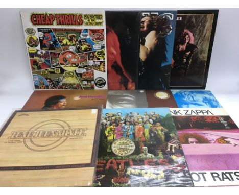 A collection of LPs by various artists from the 1960s including The Beatles, Jimi Hendrix, Big Brother &amp; The Holding Comp