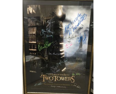 A framed and glazed Lord Of The Rings - The Two Towers US one sheet film poster with multiple signatures from cast members in
