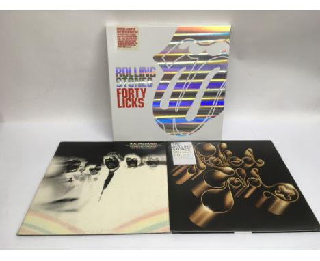 A limited edition CD box set of 'Forty Licks' by The Rolling Stones together with two vinyl LP best of collections comprising