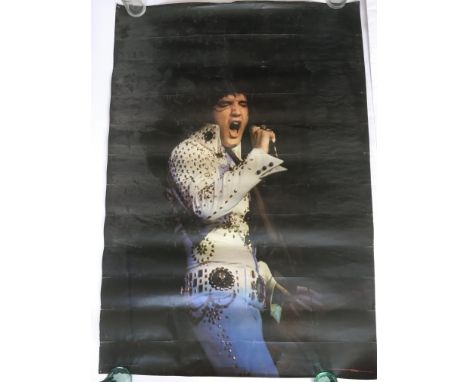 A suitcase containing various vintage posters of pop stars and film icons including Elvis Presley, Queen, Marilyn Monroe, Deb