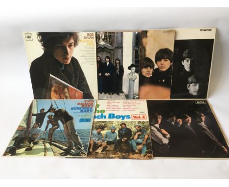 Seven LPs comprising albums by The Beatles, The Rolling Stones, The Beach Boys and Bob Dylan.