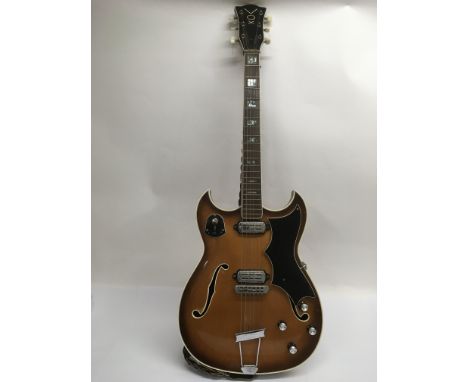 An unusual 1960s Vox hollow body electric guitar, similar in style to the Crucianelli model, with double cutaways and two hum