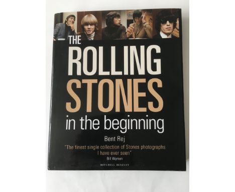 A collectable hardback book on The Rolling Stones 'In The Beginning' by Bent Rej.