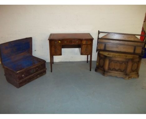 FOUR ITEMS - A METAL TRAVEL TRUNK, A LEATHER INLAID LADIES DESK, AN ERCOL PLATE RACK AND AN OAK LINENFOLD BLANKET BOX WITH A 