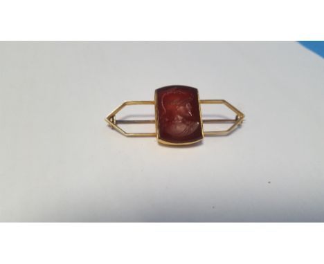 AN INTAGLIO CARVED PANEL BROOCH OF A ROMAN STYLE PROFILE on a yellow metal brooch, width 4.5 cm