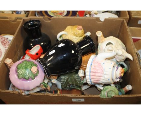 A TRAY OF CERAMIC TEAPOTS AND ORNAMENTS