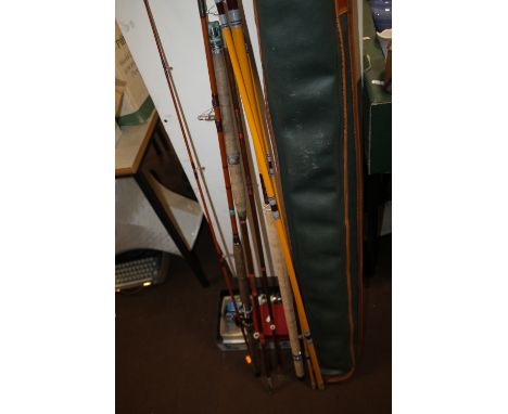 THREE VINTAGE FISHING RODS TOGETHER WITH A SMALL COLLECTION OF REELS