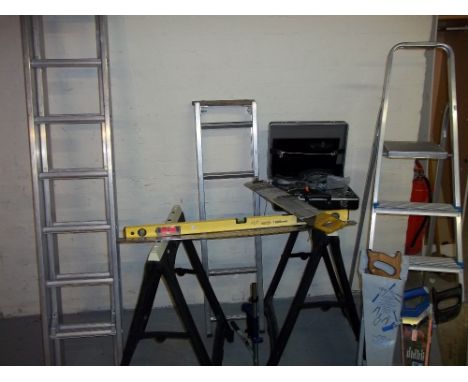 A SELECTION OF TOOLS TO INCLUDE TWO WORK TRESTLES, STEP LADDERS, EXTENDING LADDERS, HAND SAWS AND A CASE OF HAND TOOLS ETC.