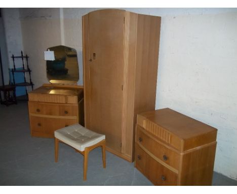 A RETRO MATCHED LIGHT OAK FOUR PIECE BEDROOM SET TO INCLUDE ONE DRESSING TABLE, ONE STOOL, ONE THREE DRAWER CHEST AND ANOTHER