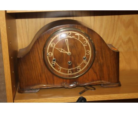 A MANTEL CLOCK WITH KEY