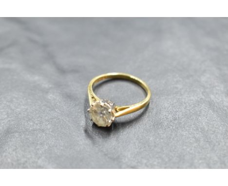 A diamond solitaire ring, approx 1.5ct in a claw set raised mount to knife blade shoulders on an 18ct gold loop, size P &amp;