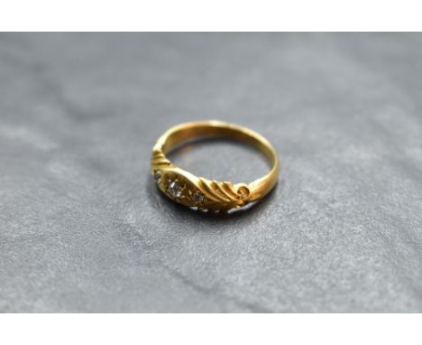 An Edwardian diamond chip set ring having a moulded mount on an 18ct gold loop, size L &amp; approx 2.8g