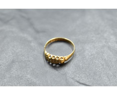 An Edwardian diamond chip set ring having a moulded mount on an 18ct gold loop, size T &amp; approx 2.1g