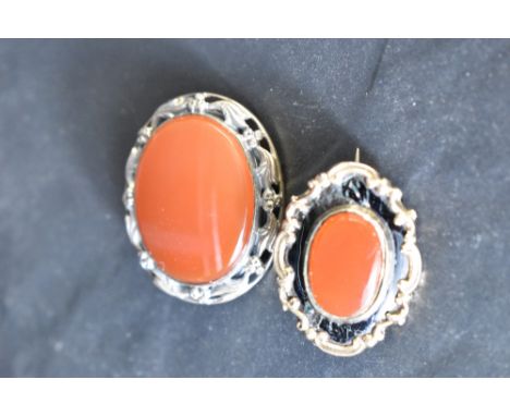 A Victorian mourning brooch having carnelian panel to front and yellow metal reverse bearing memorial inscription Mrs Fisher,