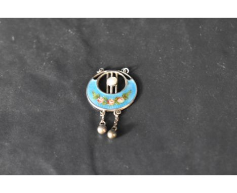 A silver and enamel pendant by Charles Horner, Chester having floral decoration and silver bead drops, missing chain