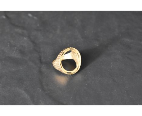 A 9ct gold coin mount ring having ribbed decoration, size T &amp; approx 6.1g