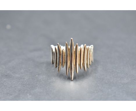 A Shaun Leane silver quill wrap ring inspred by the porcupine quill earrings designed by Leane for the 2003 Alexander McQueen