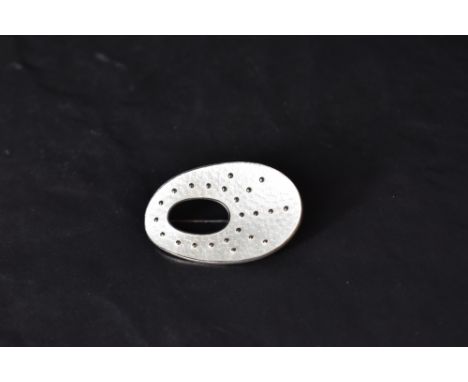 A Norwegian silver and white enamel brooch by Oystein Balle