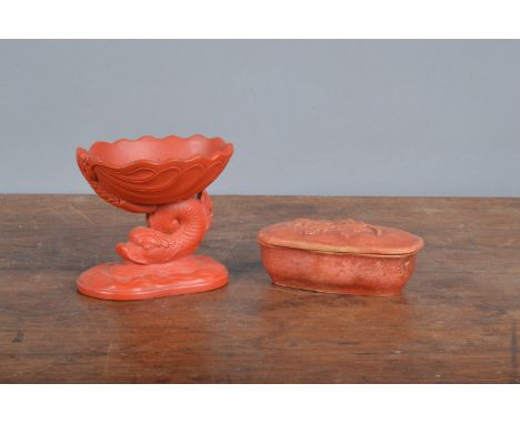 Two 19th century ceramic redware pieces,&nbsp; to include a lidded match box with integral stricker and applied leaf decorati