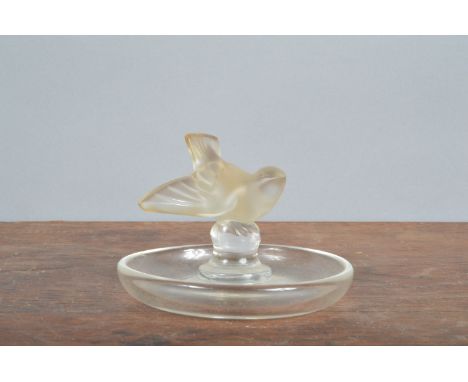 A 20th century Lalique France ashtray,&nbsp; &nbsp;marked to the underside modelled as a bird with outstretched wings. 9cm wi