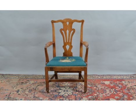 A George III mahogany armchair, probably a carver from a dinning set, shaped top rail, pierced back, shaped arms, on straight