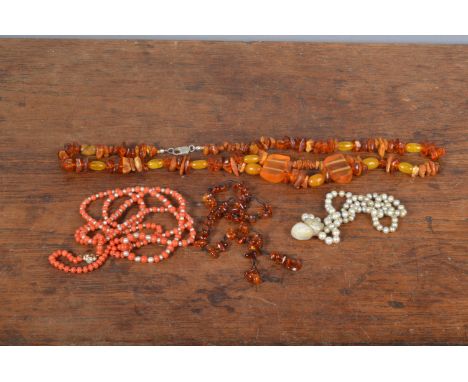 A small collection of organic jewels, including a string of coral and seed pearl beads on a 9ct gold seed pearl clasp, 53 cm 