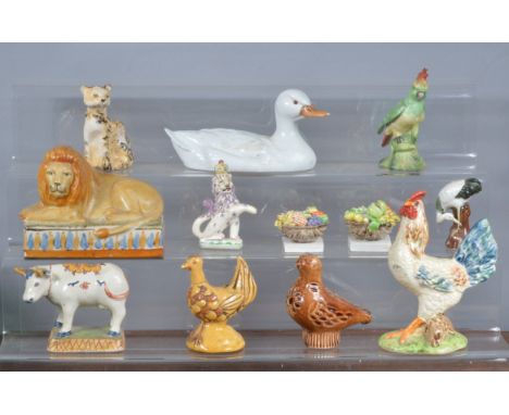 A mixed group of 19th and 20th century mainly Continental ceramic animals,  to include a faience cow, a Martinu duck, a bird 