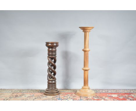 Two wooden jardinieres, one with a pierced spiral column, the other taller one lighter and with a fluted column, 76cm &amp; 9